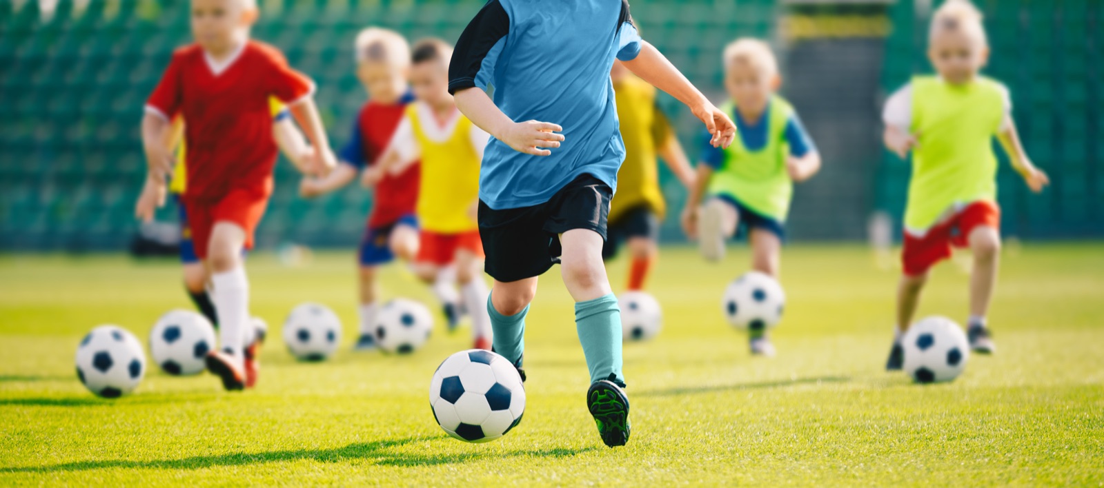 Children training together at a football coaching session